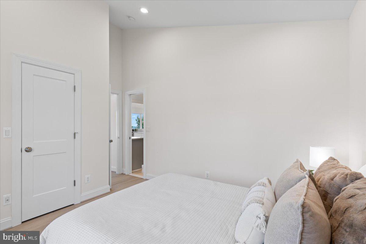 2825 Ridge Road Huntingtown, MD 20639 - Photo 25 of 66 a bedroom with a bed and a couch