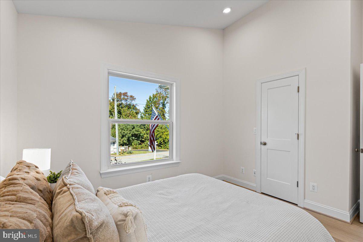 2825 Ridge Road Huntingtown, MD 20639 - Photo 25 of 67 a bedroom with a bed and a window