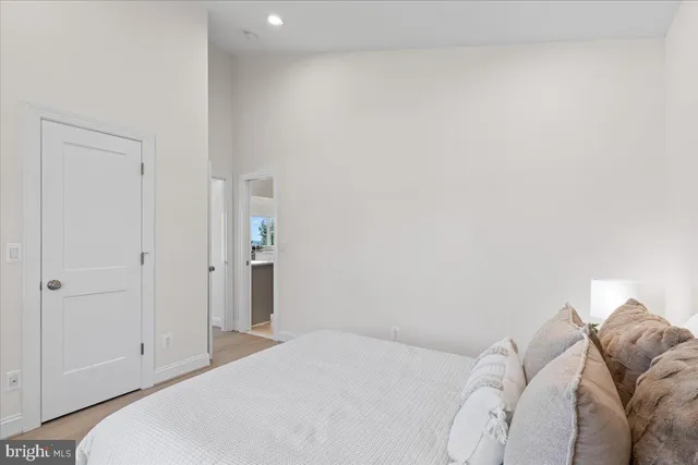 a bedroom with a bed and chair