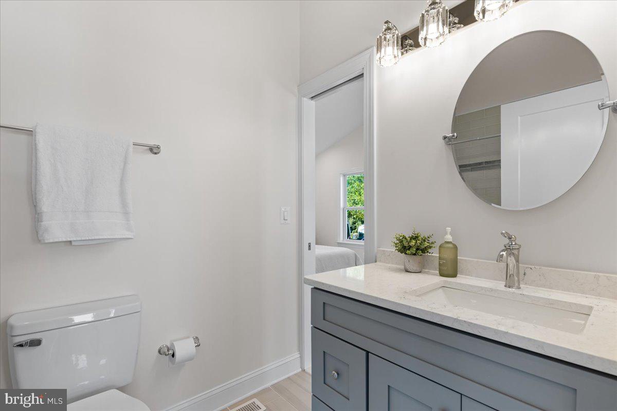 2825 Ridge Road Huntingtown, MD 20639 - Photo 26 of 66 a bathroom with a sink and a mirror
