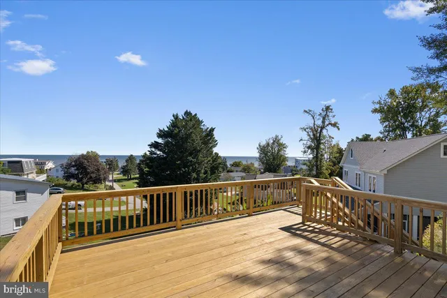 a view of deck with a large swimming pool
