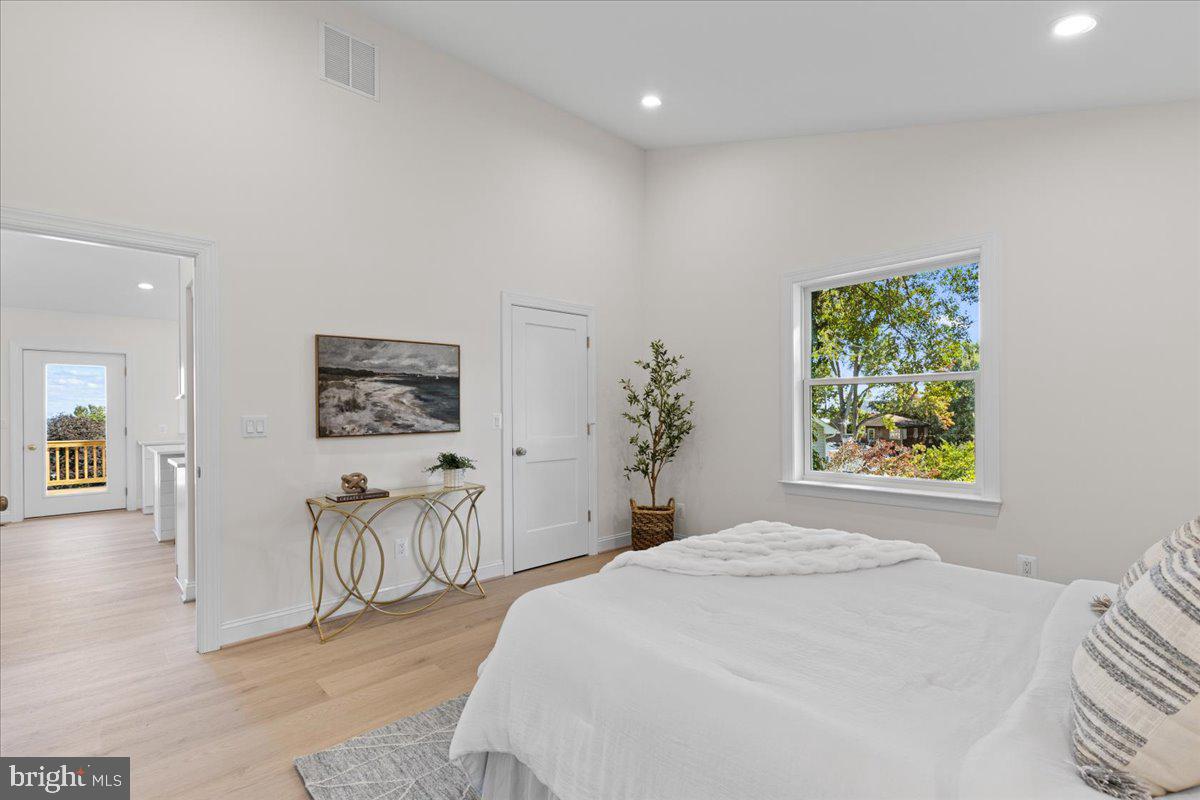 2825 Ridge Road Huntingtown, MD 20639 - Photo 30 of 66 a bedroom with a large bed and a window