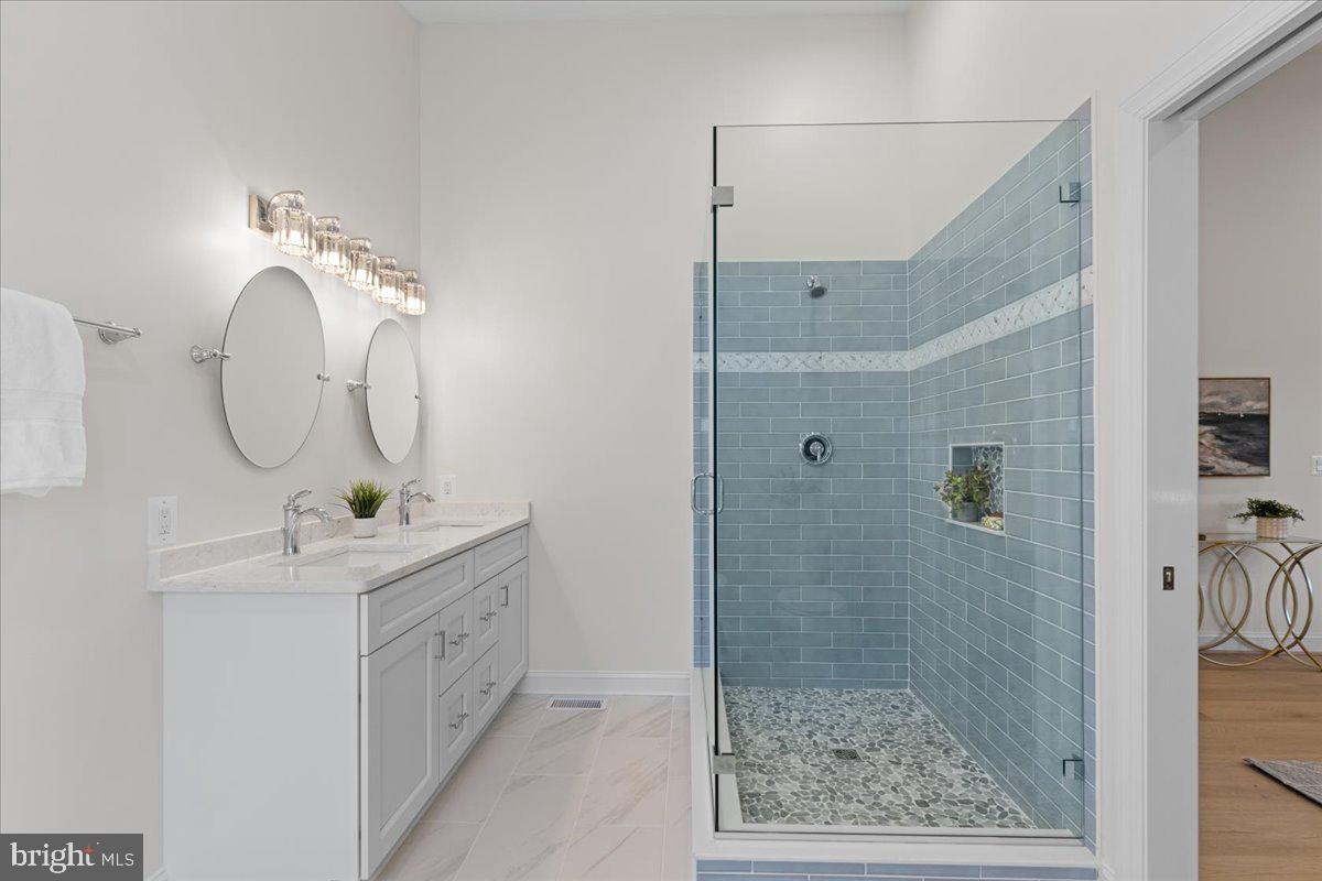 2825 Ridge Road Huntingtown, MD 20639 - Photo 32 of 67 a bathroom with a sink a toilet and shower