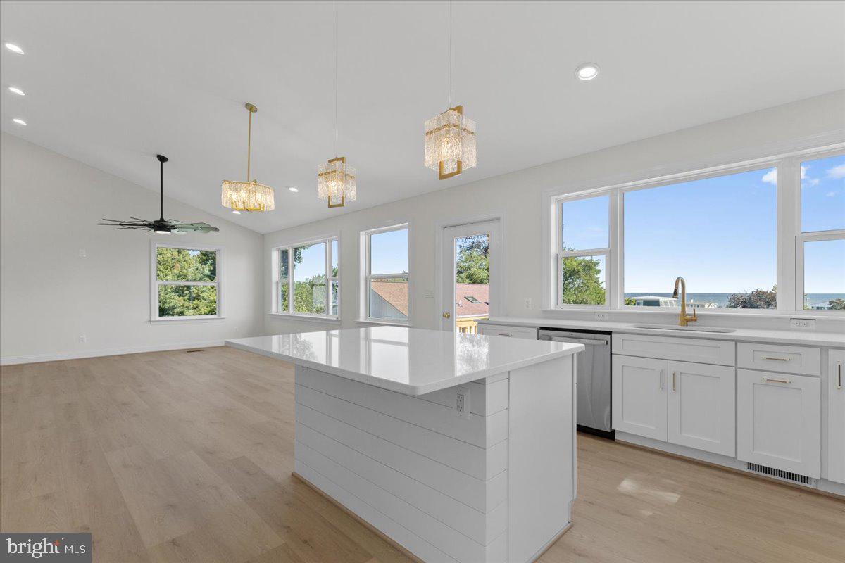2825 Ridge Road Huntingtown, MD 20639 - Photo 36 of 67 a large kitchen with kitchen island a large counter space a large window appliances and cabinets