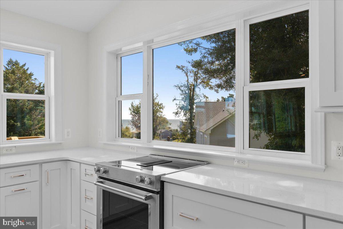 2825 Ridge Road Huntingtown, MD 20639 - Photo 40 of 67 a view of a kitchen with a stove and a window