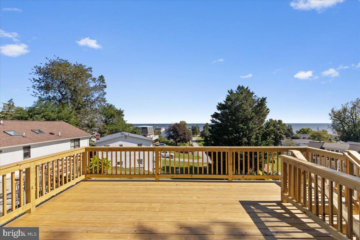 2825 Ridge Road Huntingtown, MD 20639 - Photo 40 of 66 a view of a wooden deck and a yard