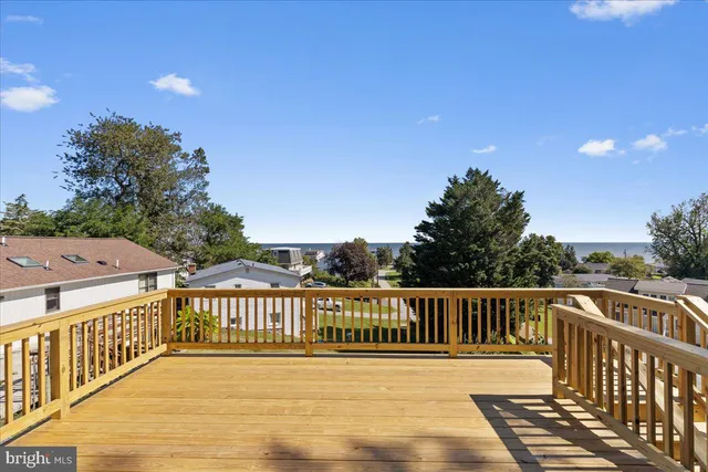 a view of a house with pool and chairs