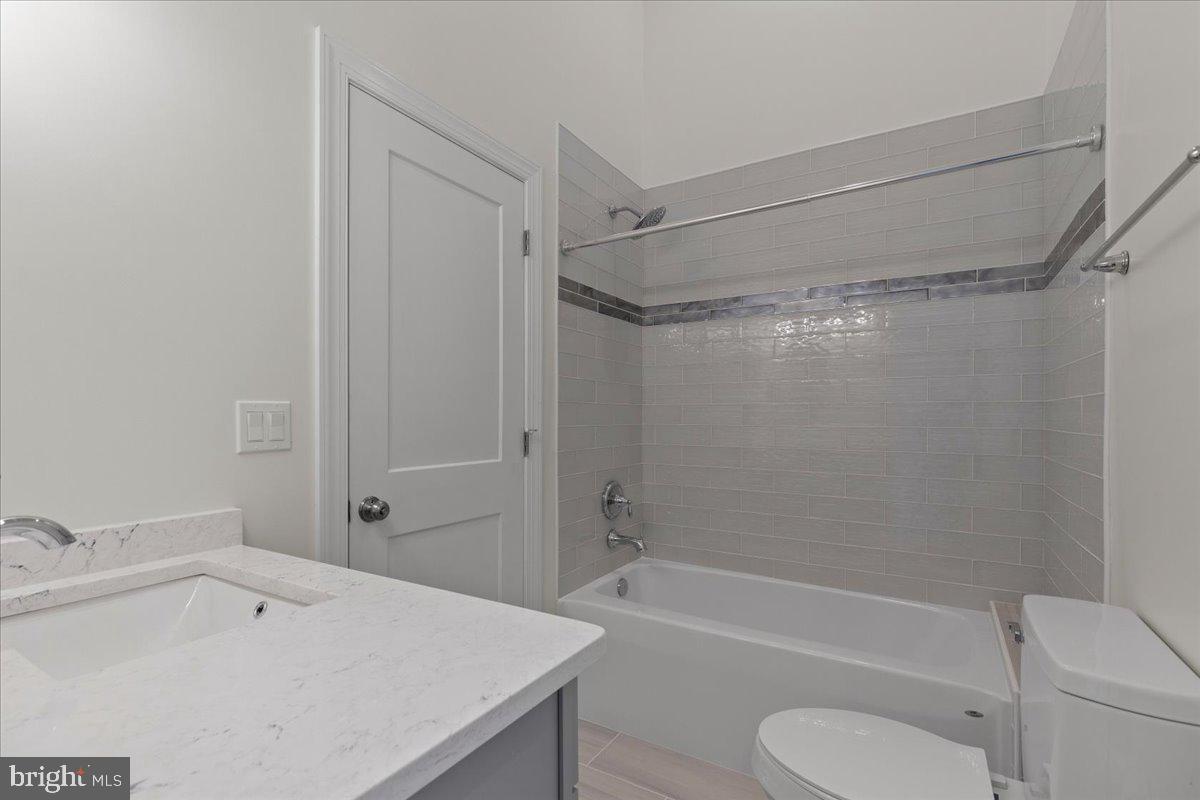 2825 Ridge Road Huntingtown, MD 20639 - Photo 44 of 66 a bathroom with a sink a toilet and a bathtub