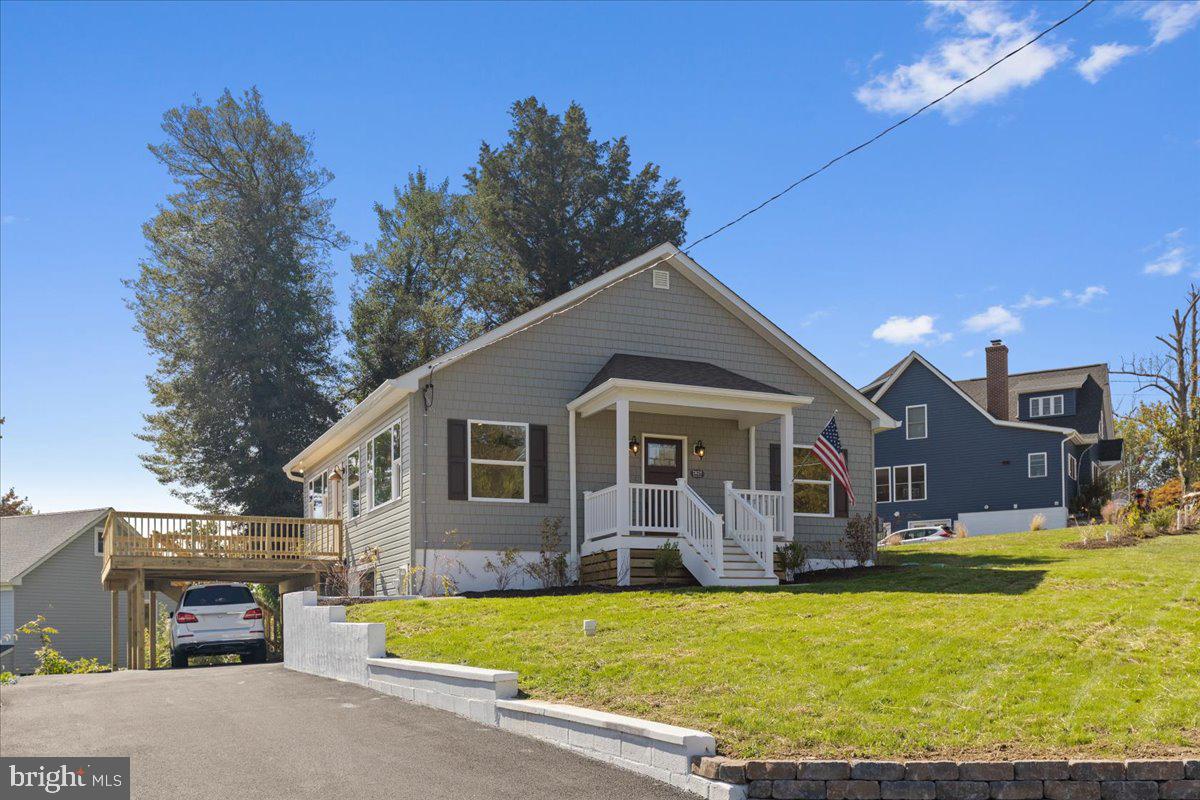 2825 Ridge Road Huntingtown, MD 20639 - Photo 49 of 67 a front view of house with yard and trees in the background