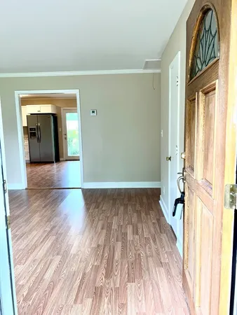 a view of livingroom with wooden floor and stairs