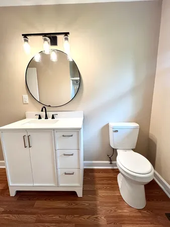 a bathroom with a sink and mirror
