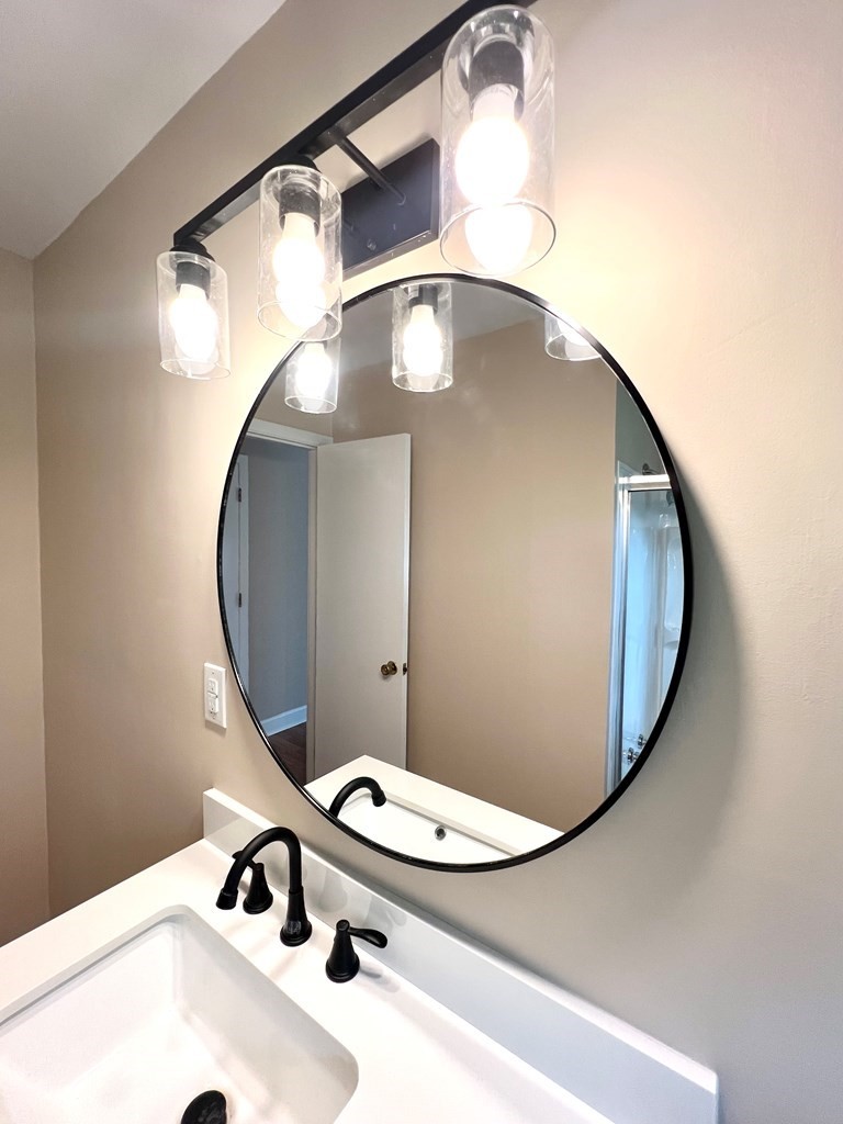 210 Roney Drive Hopkinsville, KY 42240 - Photo 25 of 29 a bathroom with a sink and mirror