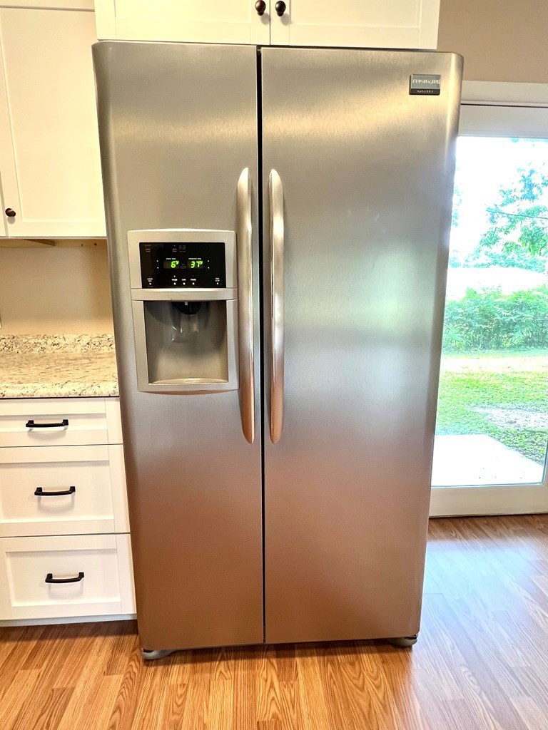 210 Roney Drive Hopkinsville, KY 42240 - Photo 6 of 29 a close view of a refrigerator in kitchen and wooden floor
