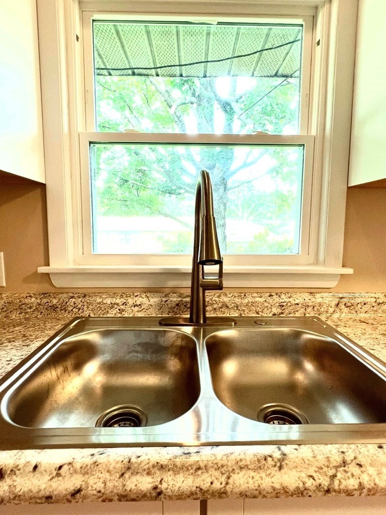 210 Roney Drive Hopkinsville, KY 42240 - Photo 10 of 29 a bathroom with a granite countertop sink and a window