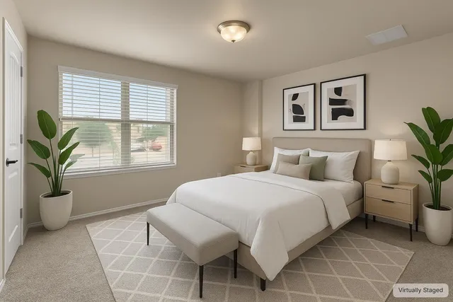 a bedroom with a bed and a potted plant