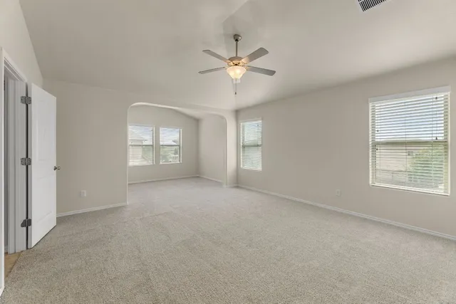 a view of an empty room with a window