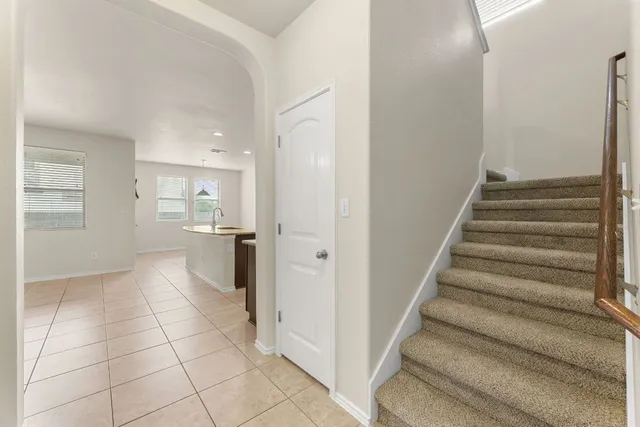 a view of a kitchen with a sink and dishwasher cabinets