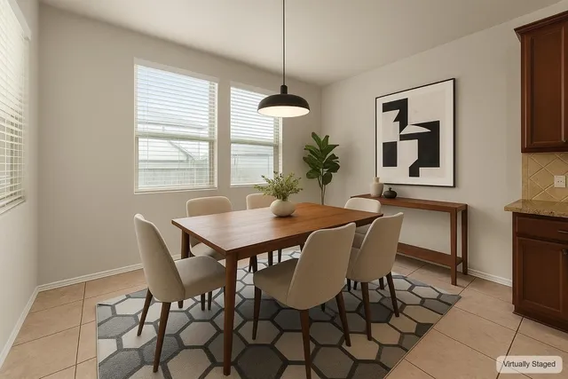 a dining room with furniture and window