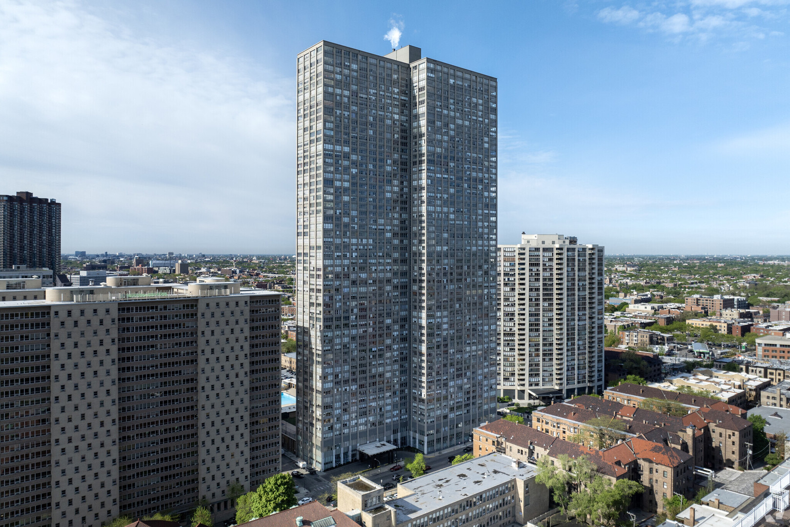 655 West Irving Park Road, Unit 508 Chicago, IL 60613 - Photo 1 of 15 a view of a city with tall buildings