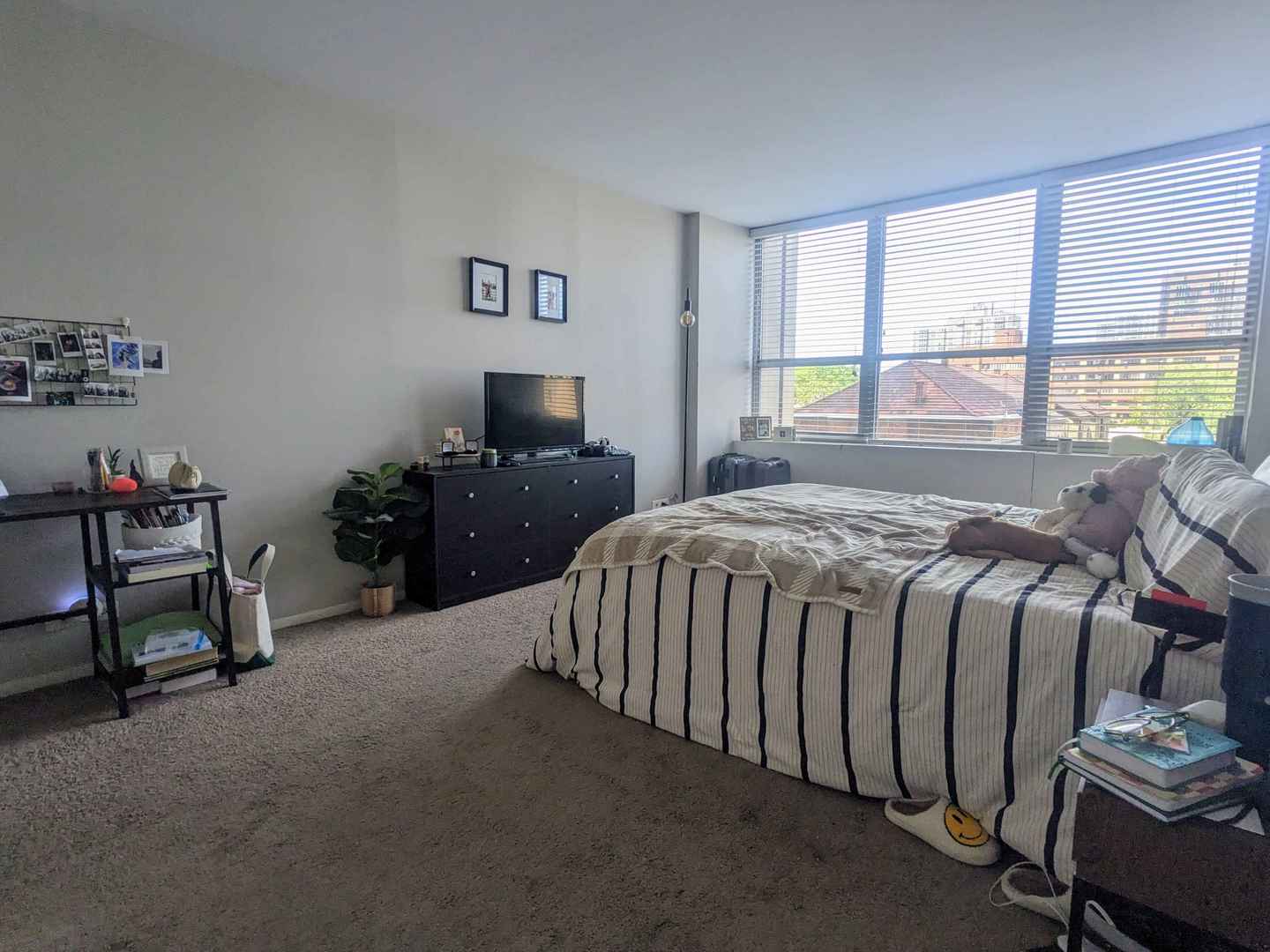 655 West Irving Park Road, Unit 508 Chicago, IL 60613 - Photo 12 of 15 a bed sitting in a bedroom next to a window
