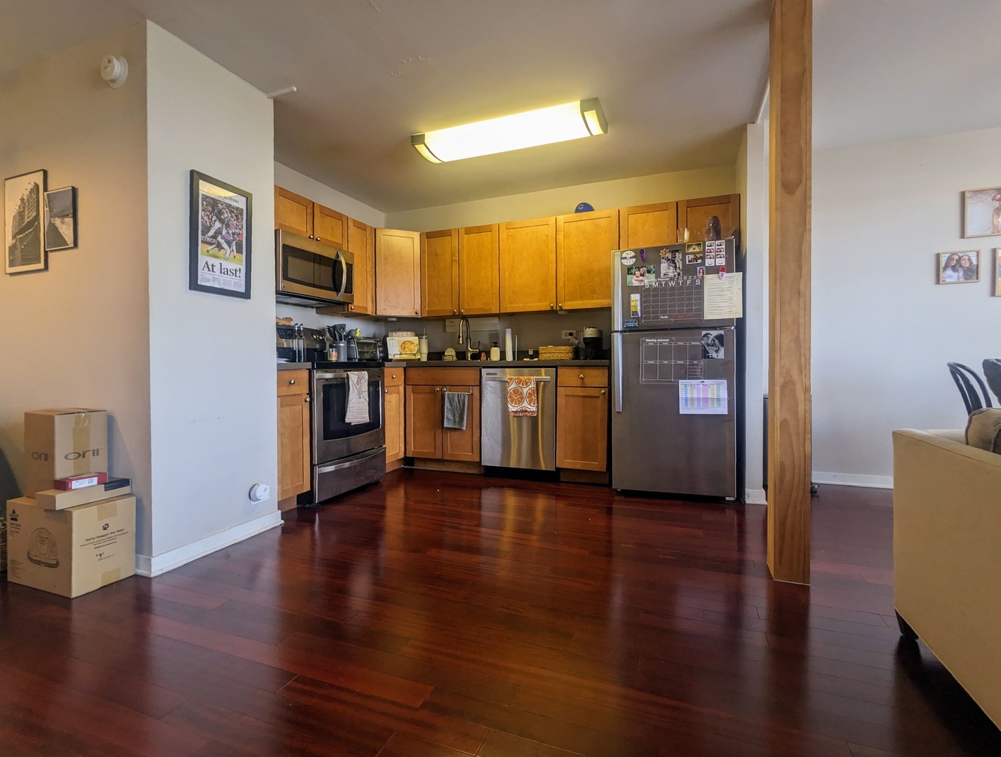 655 West Irving Park Road, Unit 508 Chicago, IL 60613 - Photo 15 of 15 a view of a kitchen with furniture wooden floor and window