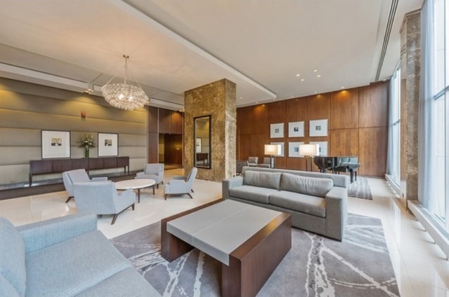 655 West Irving Park Road, Unit 508 Chicago, IL 60613 - Photo 2 of 15 a living room with furniture and a large window