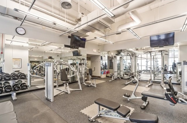655 West Irving Park Road, Unit 508 Chicago, IL 60613 - Photo 5 of 15 a view of a room with gym equipment