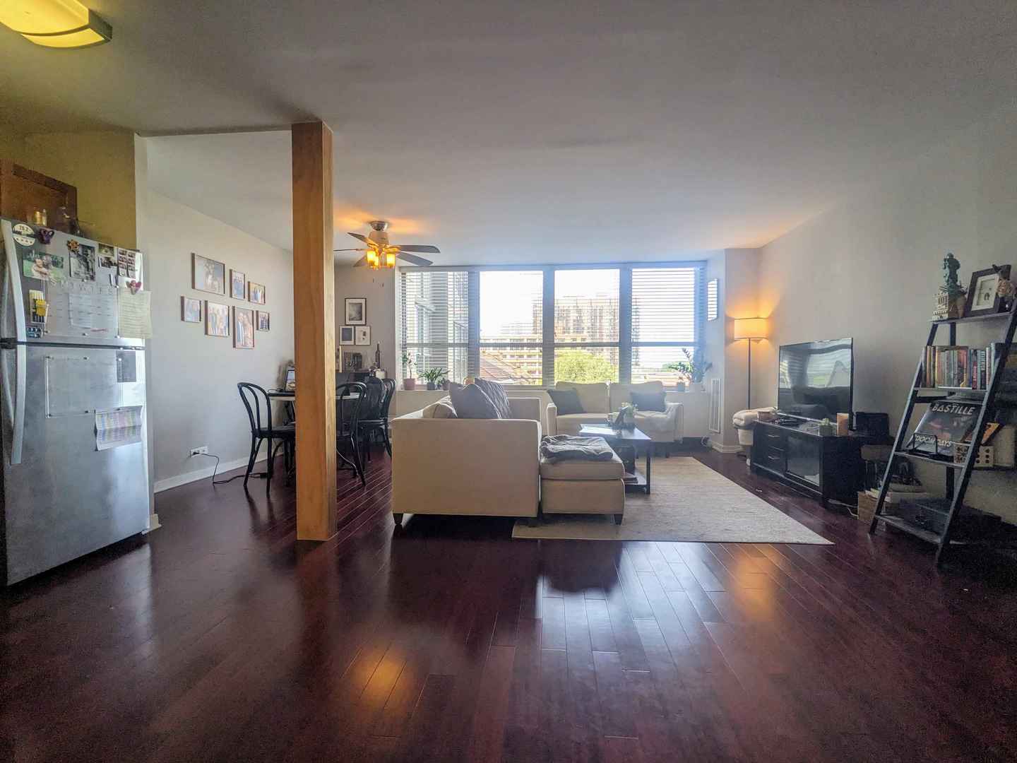 655 West Irving Park Road, Unit 508 Chicago, IL 60613 - Photo 7 of 15 a living room with furniture and a large window