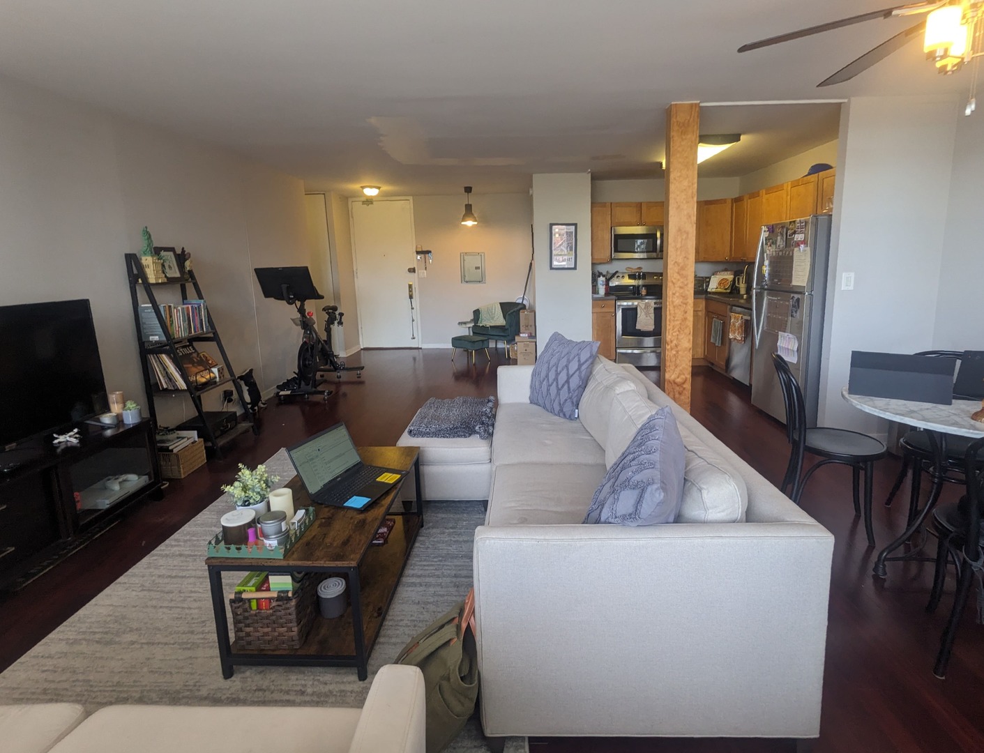 655 West Irving Park Road, Unit 508 Chicago, IL 60613 - Photo 9 of 15 a living room with furniture and a flat screen tv