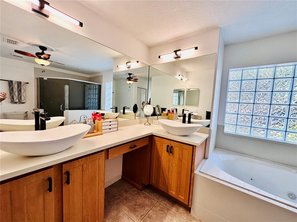 3840 Marietta Way St. Cloud, FL 34772 - Photo 14 of 44 a kitchen with a sink and a large mirror