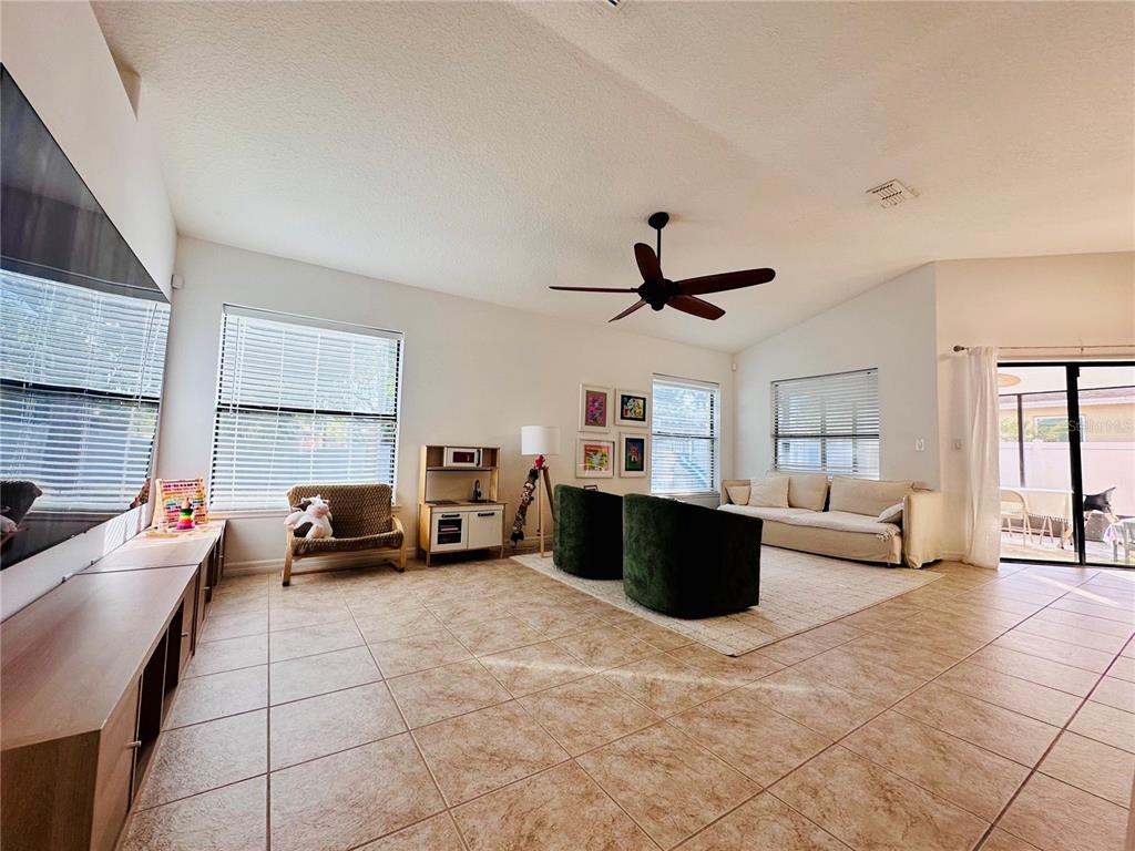 3840 Marietta Way St. Cloud, FL 34772 - Photo 23 of 44 a living room with furniture and a couch