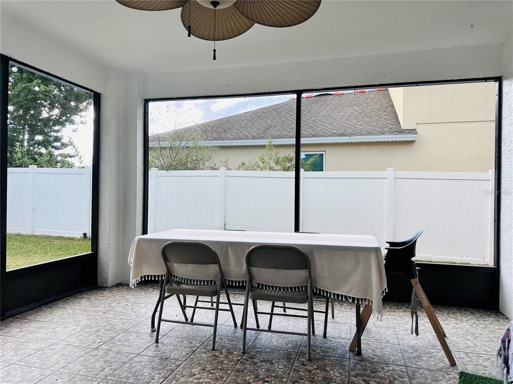 3840 Marietta Way St. Cloud, FL 34772 - Photo 39 of 44 a table and chairs in a room next to a window