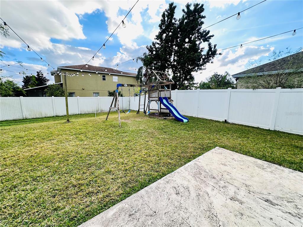 3840 Marietta Way St. Cloud, FL 34772 - Photo 43 of 44 a view of a swimming pool with a yard