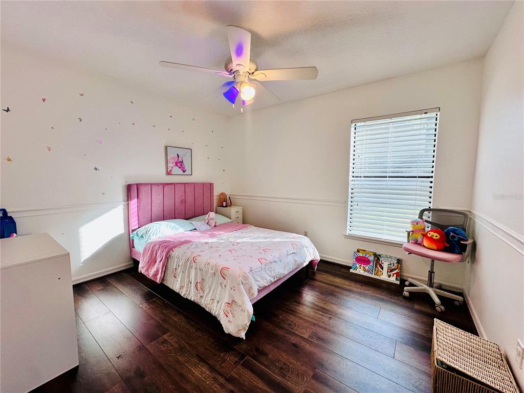 3840 Marietta Way St. Cloud, FL 34772 - Photo 8 of 44 a bedroom with a bed and a window