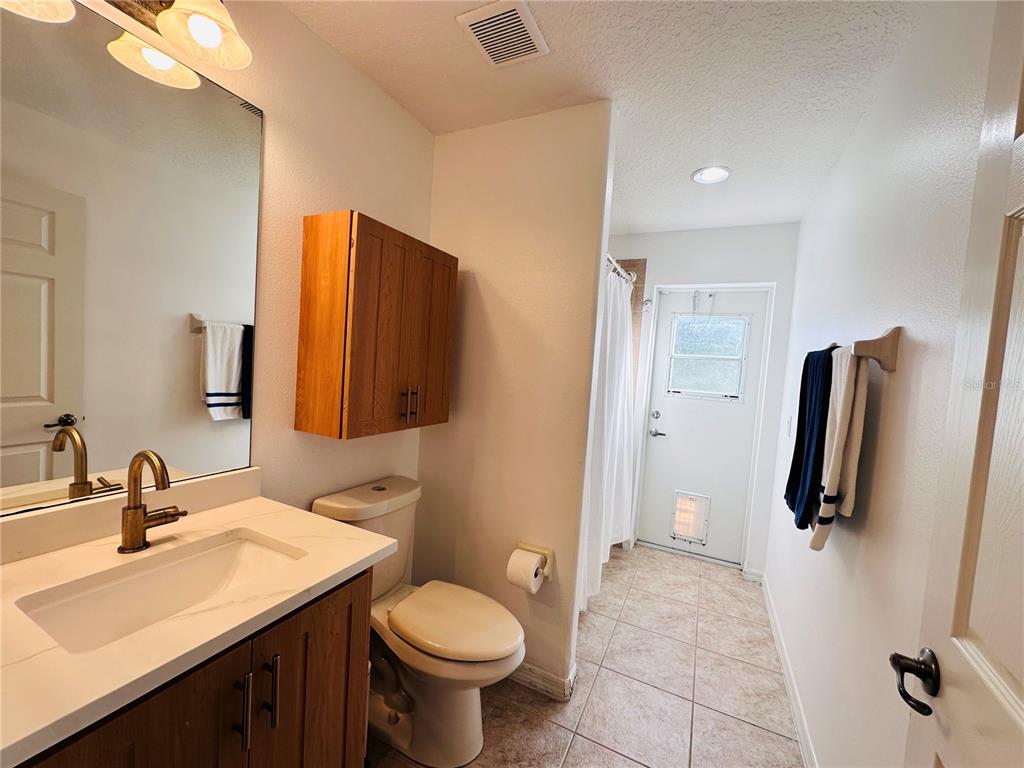 3840 Marietta Way St. Cloud, FL 34772 - Photo 9 of 44 a bathroom with a sink toilet and shower