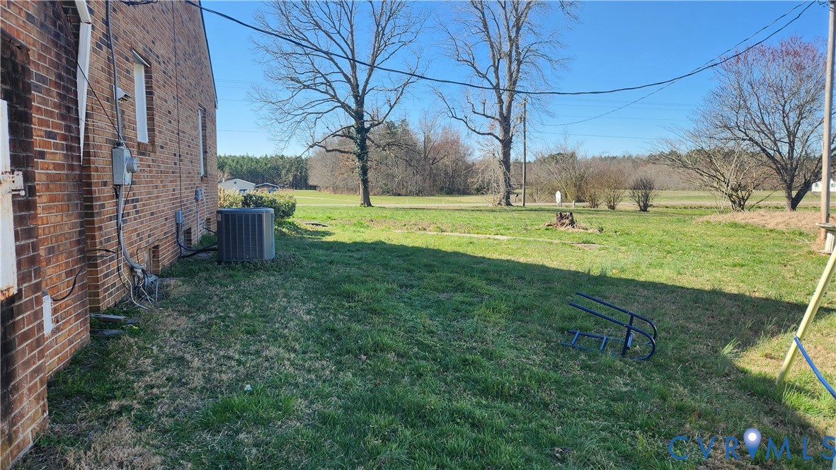 24816 Sawmill Road Carson, VA 23830 - Photo 4 of 24 Brick exterior with a central HVAC unit
