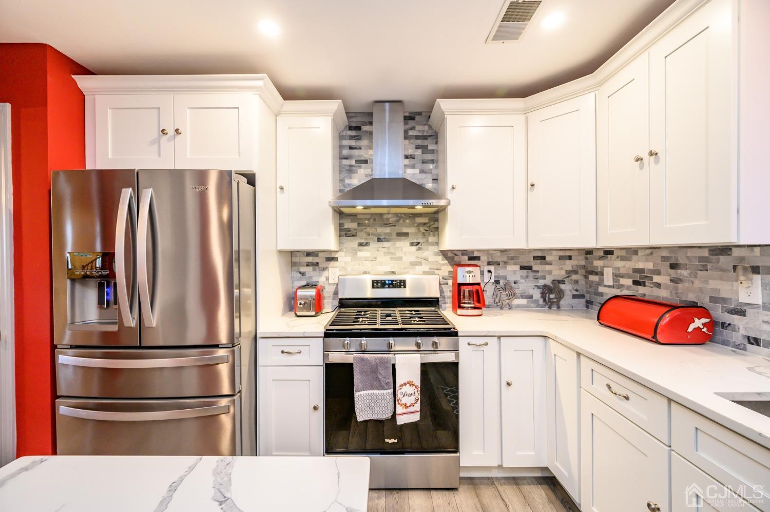 1 Rutgers Drive Howell, NJ 07731 - Photo 14 of 43 a kitchen with stainless steel appliances granite countertop a refrigerator sink stove and cabinets
