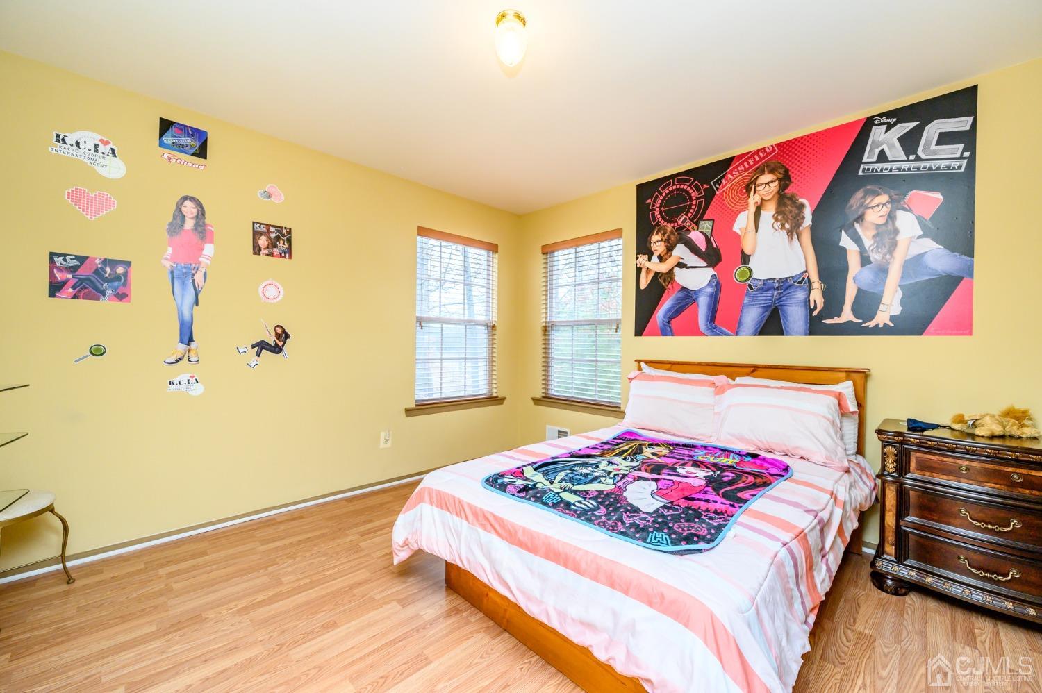 1 Rutgers Drive Howell, NJ 07731 - Photo 22 of 43 a bedroom with a bed and a painting on the wall