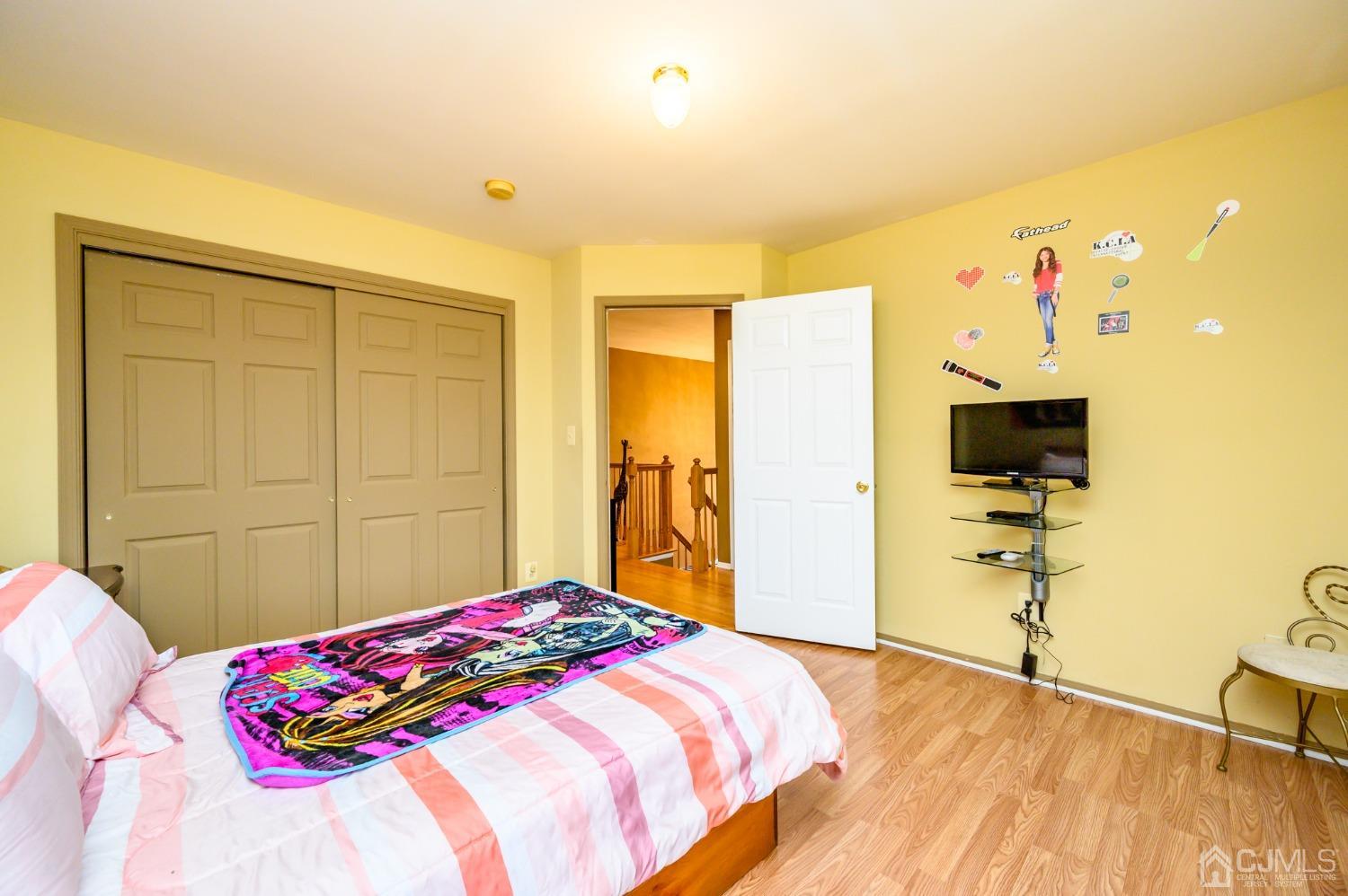 1 Rutgers Drive Howell, NJ 07731 - Photo 23 of 43 a bedroom with a bed and a flat screen tv
