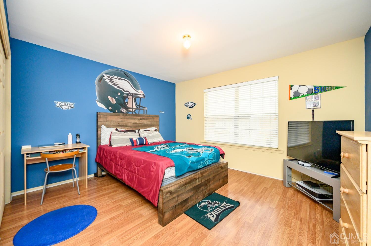 1 Rutgers Drive Howell, NJ 07731 - Photo 24 of 43 a bedroom with a bed and a wooden floor