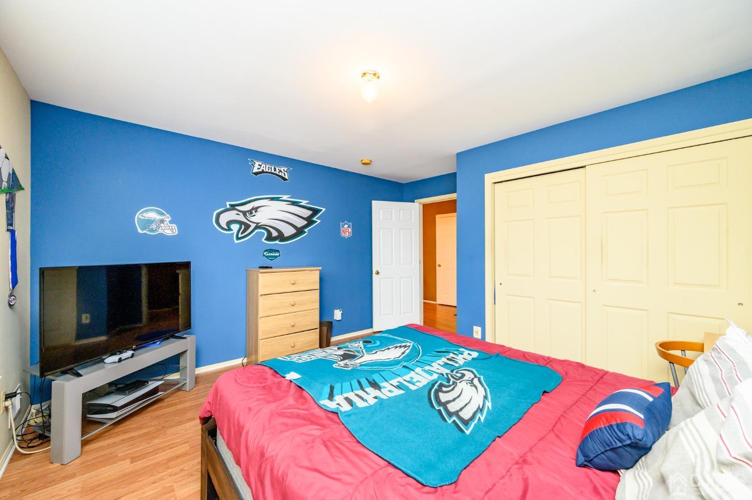 1 Rutgers Drive Howell, NJ 07731 - Photo 25 of 43 a bedroom with a bed and a flat screen tv