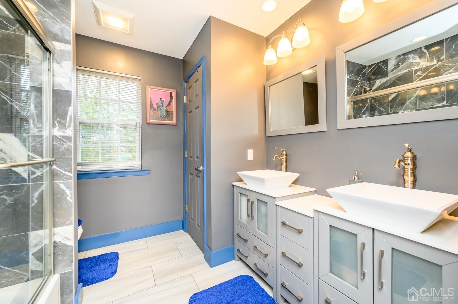 1 Rutgers Drive Howell, NJ 07731 - Photo 26 of 43 a bathroom with a sink a vanity and a mirror