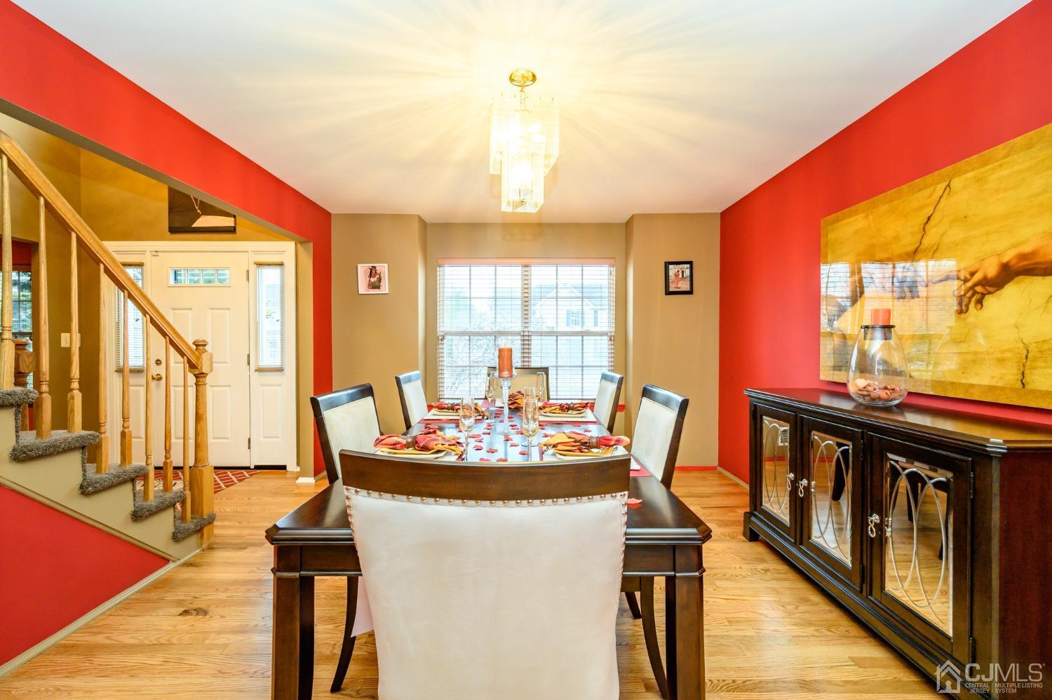 1 Rutgers Drive Howell, NJ 07731 - Photo 7 of 43 a dining room with furniture a chandelier and wooden floor
