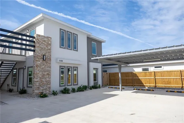 front view of a brick house with a garage