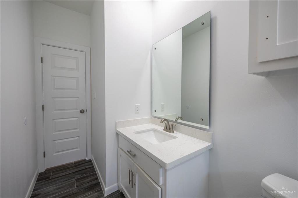 1106 Copper Avenue, Unit 4 San Juan, TX 78589 - Photo 14 of 20 a bathroom with a sink and a mirror