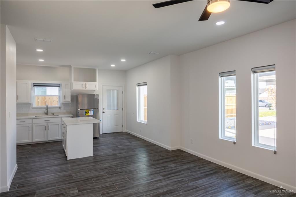 1106 Copper Avenue, Unit 4 San Juan, TX 78589 - Photo 7 of 20 a kitchen with a wooden floor and window