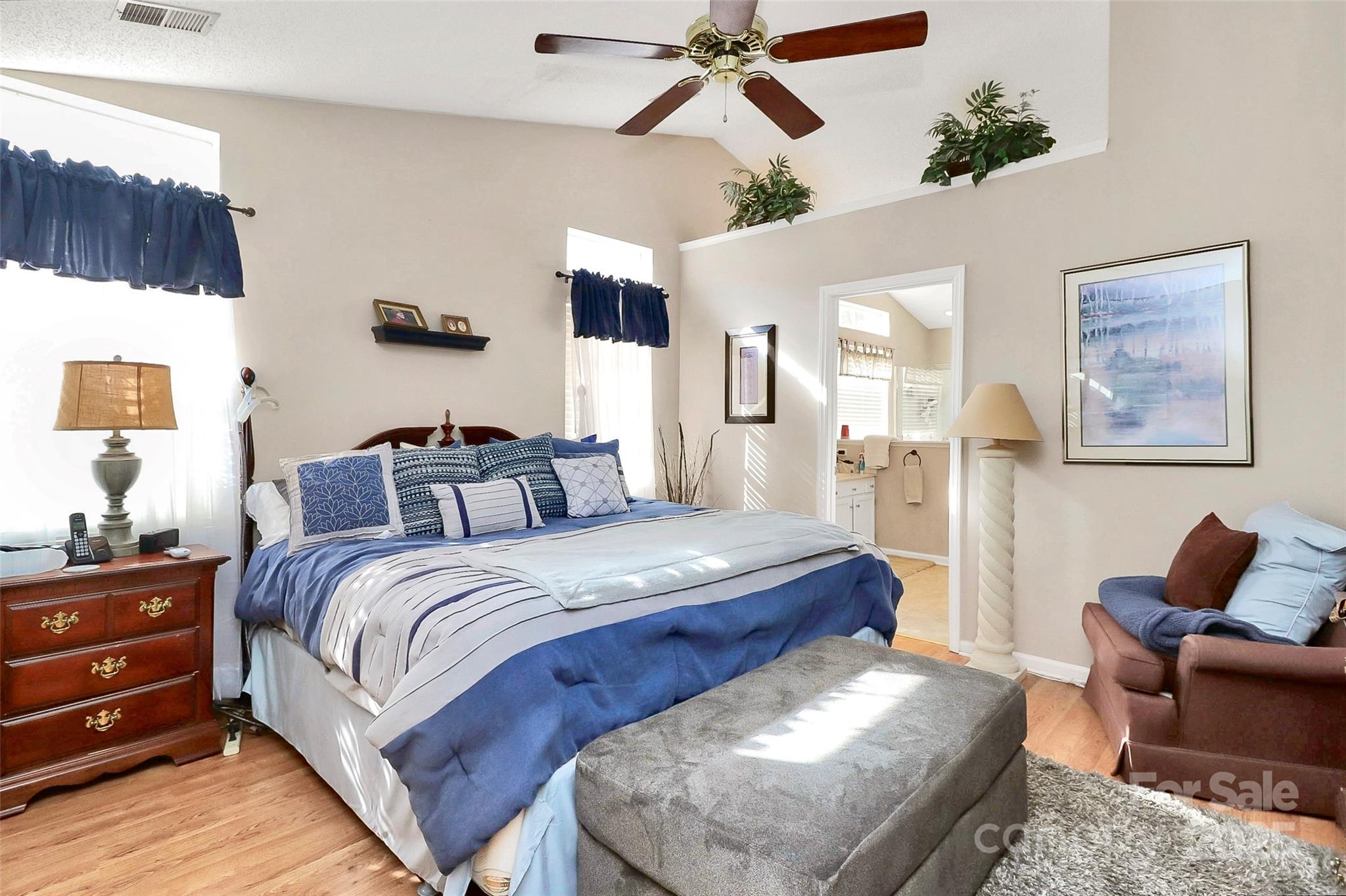 493 Debra Circle Southwest Concord, NC 28025 - Photo 12 of 27 a spacious bedroom with a bed and ceiling fan