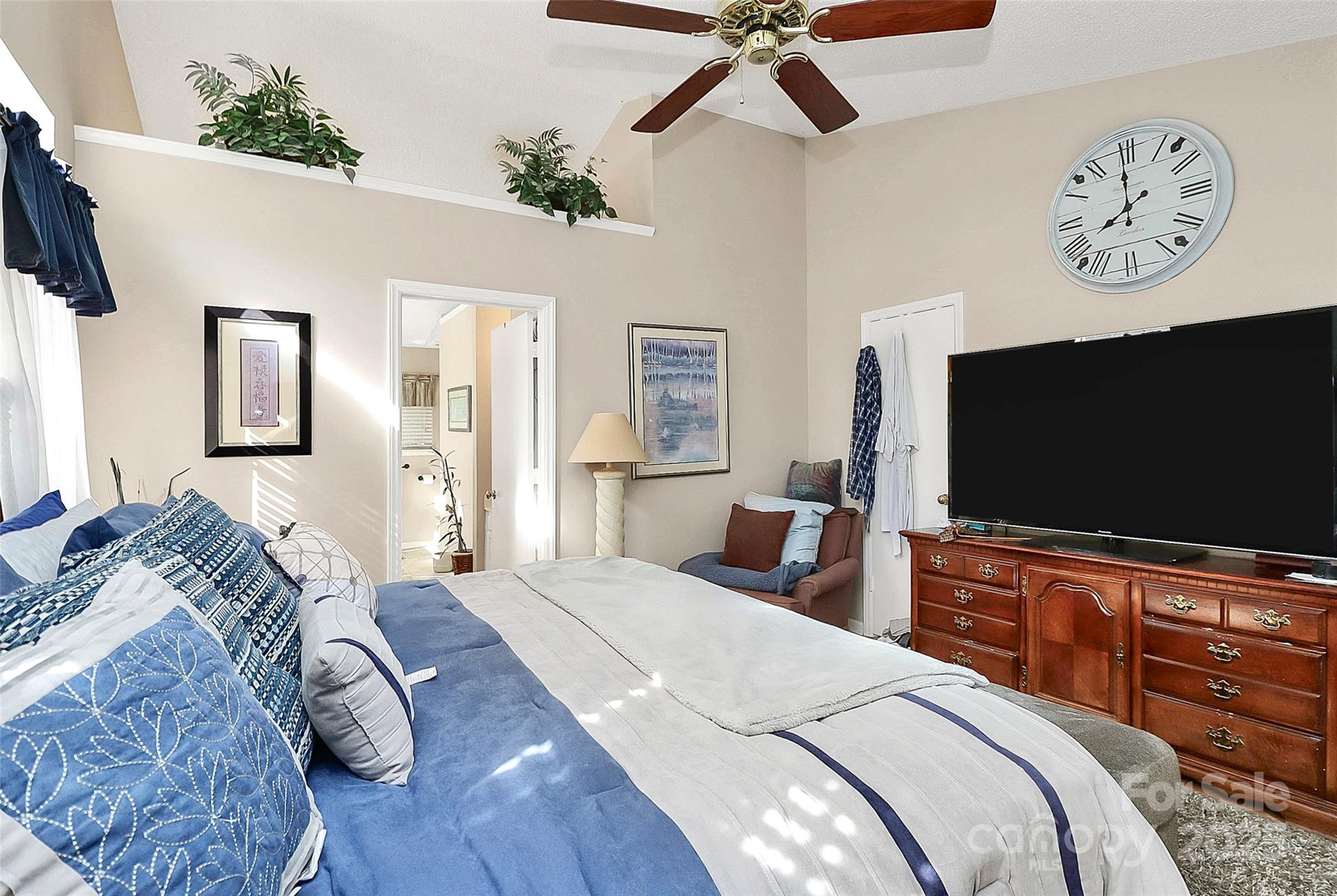 493 Debra Circle Southwest Concord, NC 28025 - Photo 13 of 27 a bedroom with a bed and a flat screen tv