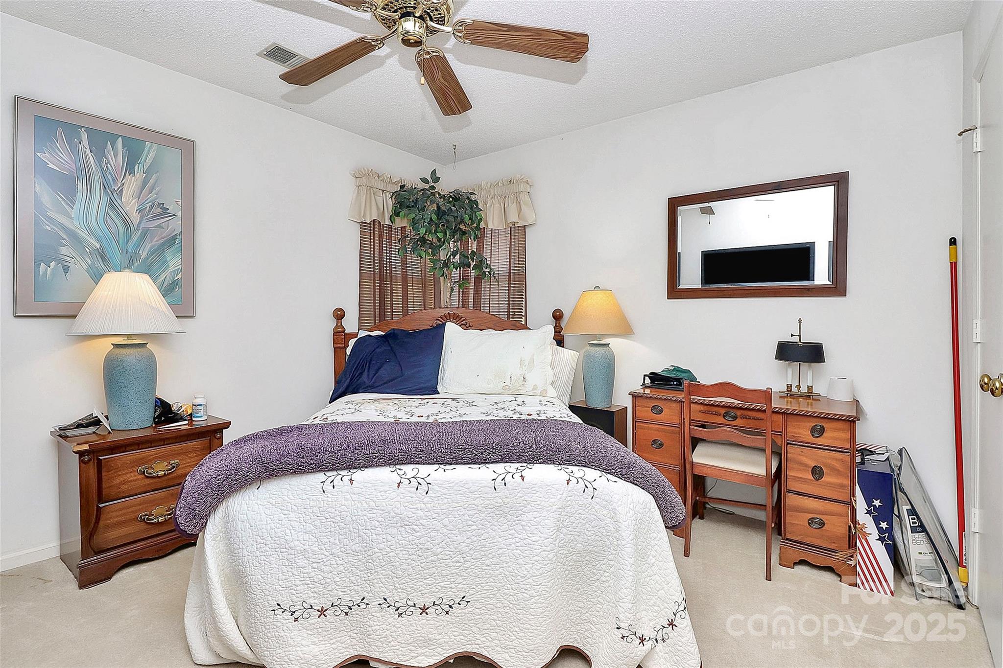 493 Debra Circle Southwest Concord, NC 28025 - Photo 17 of 27 a bedroom with a bed and a chandelier