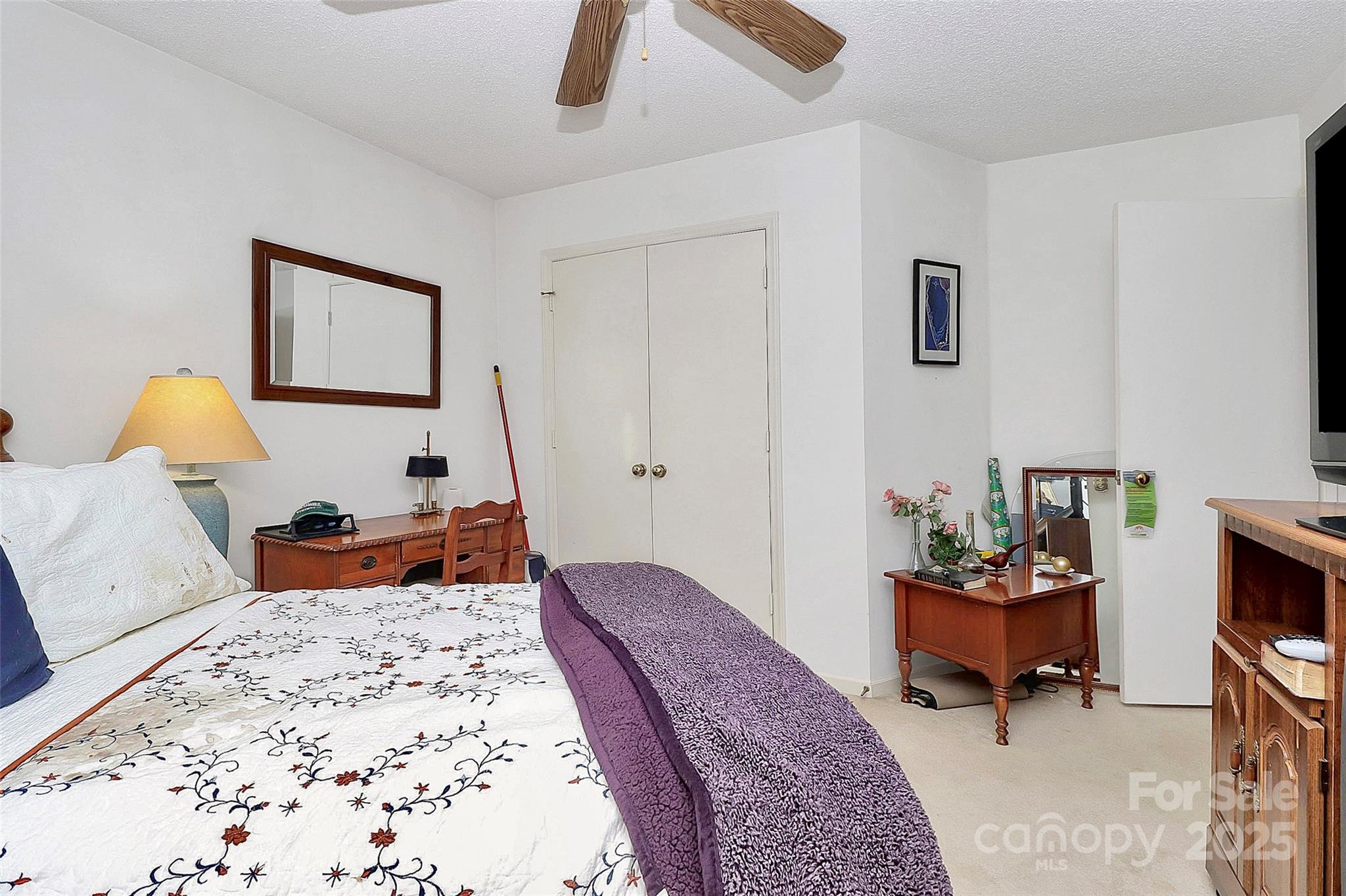 493 Debra Circle Southwest Concord, NC 28025 - Photo 18 of 27 a bedroom with a bed and a chandelier